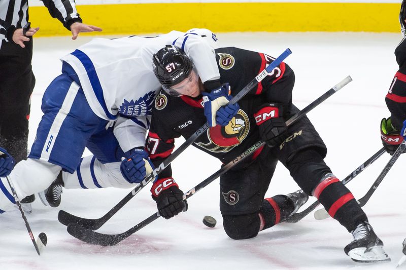 Feb 10, 2024; Ottawa, Ontario, CAN; Toronto Maple Leafs center John Tavares (1) faces off against Ottawa Senators center Shane Pinto (57) in the third period at the Canadian Tire Centre. Mandatory Credit: Marc DesRosiers-USA TODAY Sports