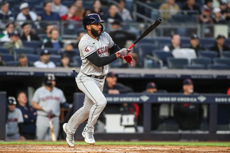 May 2, 2023; Bronx, New York, USA;  Cleveland Guardians shortstop Amed Rosario (1) hits a single in the third inning against the New York Yankees at Yankee Stadium. Mandatory Credit: Wendell Cruz-USA TODAY Sports