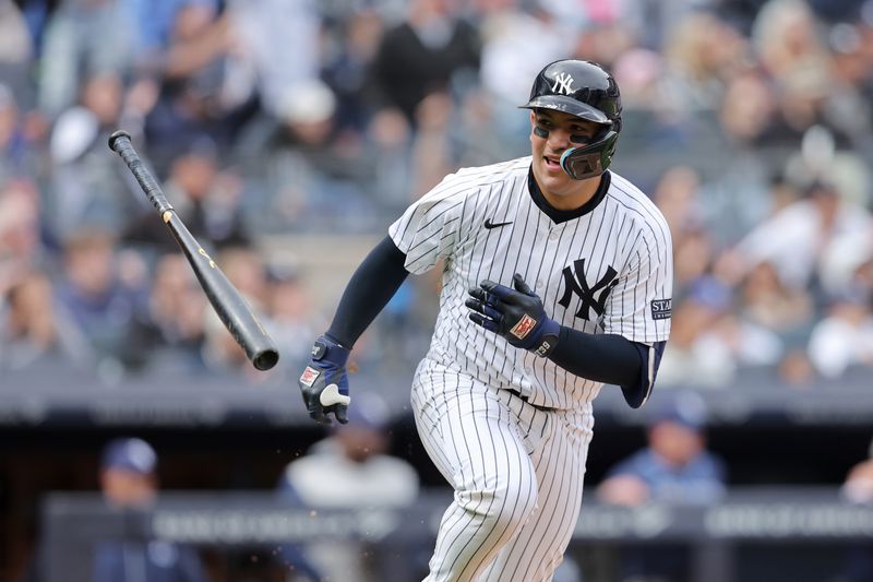 Apr 21, 2024; Bronx, New York, USA; New York Yankees catcher Jose Trevino (39) tosses his bat after hitting an RBI single against the Tampa Bay Rays during the fifth inning at Yankee Stadium. Mandatory Credit: Brad Penner-USA TODAY Sports