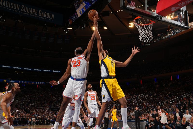 NEW YORK, NY - MAY 23: Mitchell Robinson #23 of the New York Knicks and Tony Bradley #13 of the Indiana Pacers go up for the rebound during the game against the Indiana Pacers during Game 2 of the 2025 Eastern Conference Finals on May 23, 2025 at Madison Square Garden in New York City, New York.  NOTE TO USER: User expressly acknowledges and agrees that, by downloading and or using this photograph, User is consenting to the terms and conditions of the Getty Images License Agreement. Mandatory Copyright Notice: Copyright 2025 NBAE  (Photo by Jesse D. Garrabrant/NBAE via Getty Images)