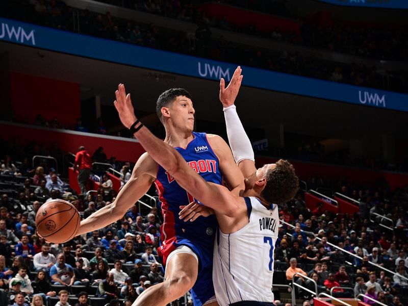 DETROIT, MI - MARCH 9: Simone Fontecchio #19 of the Detroit Pistons looks to pass the ball during the game against the Dallas Mavericks on March 9, 2024 at Little Caesars Arena in Detroit, Michigan. NOTE TO USER: User expressly acknowledges and agrees that, by downloading and/or using this photograph, User is consenting to the terms and conditions of the Getty Images License Agreement. Mandatory Copyright Notice: Copyright 2024 NBAE (Photo by Chris Schwegler/NBAE via Getty Images)