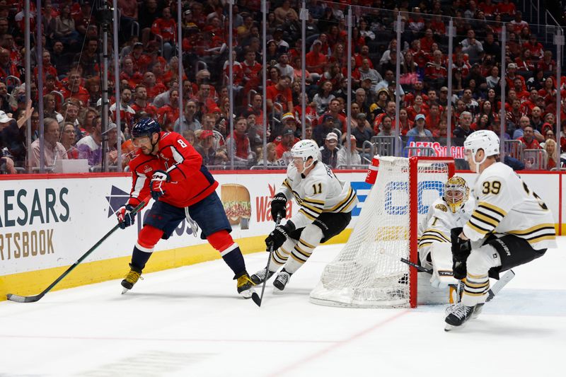 Apr 15, 2024; Washington, District of Columbia, USA; Washington Capitals left wing Alex Ovechkin (8) skates with the puck behind Boston Bruins goaltender Jeremy Swayman (1) as Bruins center Trent Frederic (11) defends in the third period at Capital One Arena. Mandatory Credit: Geoff Burke-USA TODAY Sports