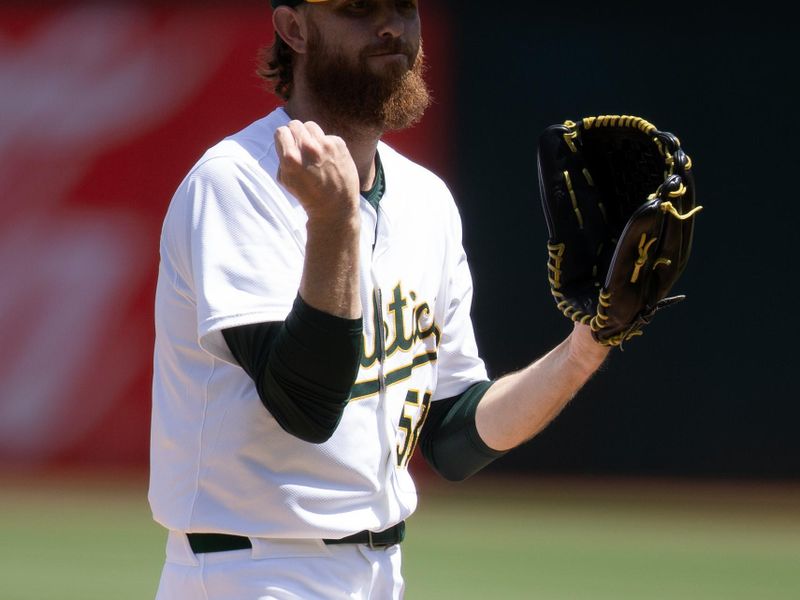 Apr 17, 2024; Oakland, California, USA; Oakland Athletics starting pitcher Paul Blackburn (58) reacts to allowing a walk against the St. Louis Cardinals during the first inning at Oakland-Alameda County Coliseum. Mandatory Credit: D. Ross Cameron-USA TODAY Sports