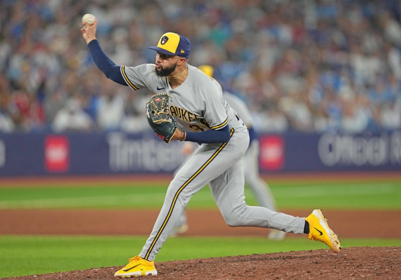 May 31, 2023; Toronto, Ontario, CAN; Milwaukee Brewers relief pitcher Devin Williams (38) throws a pitch against the Toronto Blue Jays during the ninth inning at Rogers Centre. Mandatory Credit: Nick Turchiaro-USA TODAY Sports