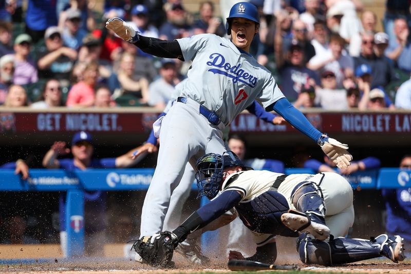 Apr 10, 2024; Minneapolis, Minnesota, USA; Minnesota Twins catcher Christian Vazquez (8) tags out Los Angeles Dodgers designated hitter Shohei Ohtani (17) at home plate during the seventh inning at Target Field. Mandatory Credit: Matt Krohn-USA TODAY Sports