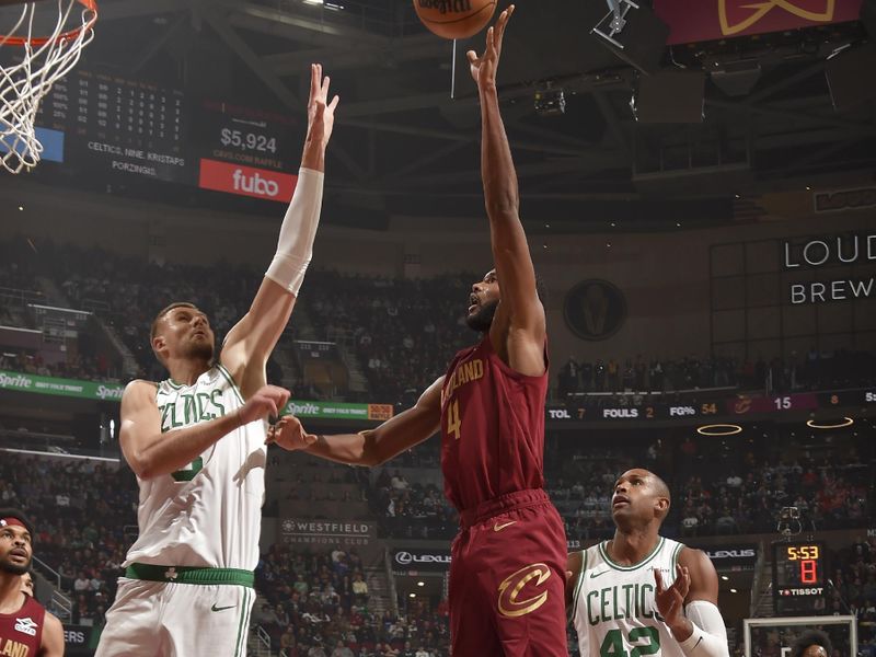 CLEVELAND, OH - DECEMBER 1: Evan Mobley #4 of the Cleveland Cavaliers shoots the ball during the game against the Boston Celtics on December 1, 2024 at Rocket Mortgage FieldHouse in Cleveland, Ohio. NOTE TO USER: User expressly acknowledges and agrees that, by downloading and/or using this Photograph, user is consenting to the terms and conditions of the Getty Images License Agreement. Mandatory Copyright Notice: Copyright 2024 NBAE (Photo by David Liam Kyle/NBAE via Getty Images)