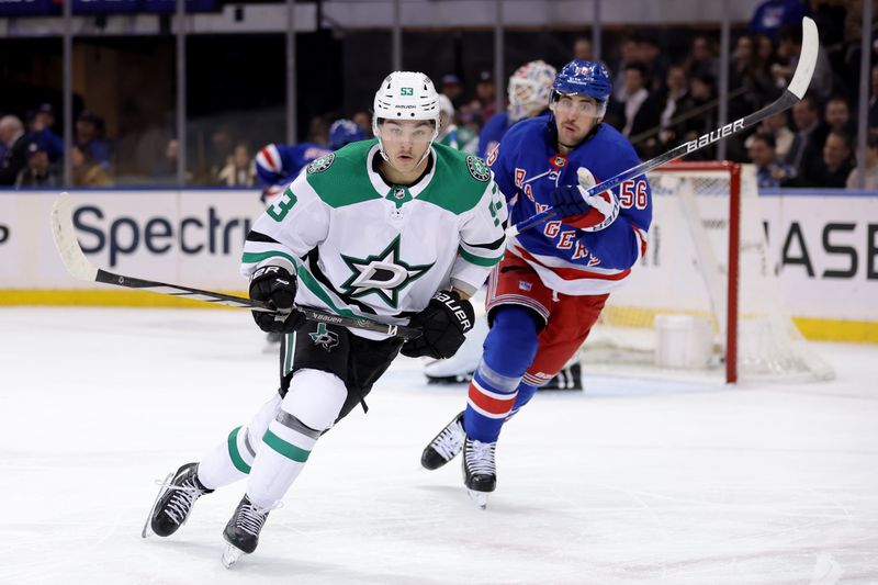 Feb 20, 2024; New York, New York, USA; Dallas Stars center Wyatt Johnston (53) skates against New York Rangers defenseman Erik Gustafsson (56) during the second period at Madison Square Garden. Mandatory Credit: Brad Penner-USA TODAY Sports