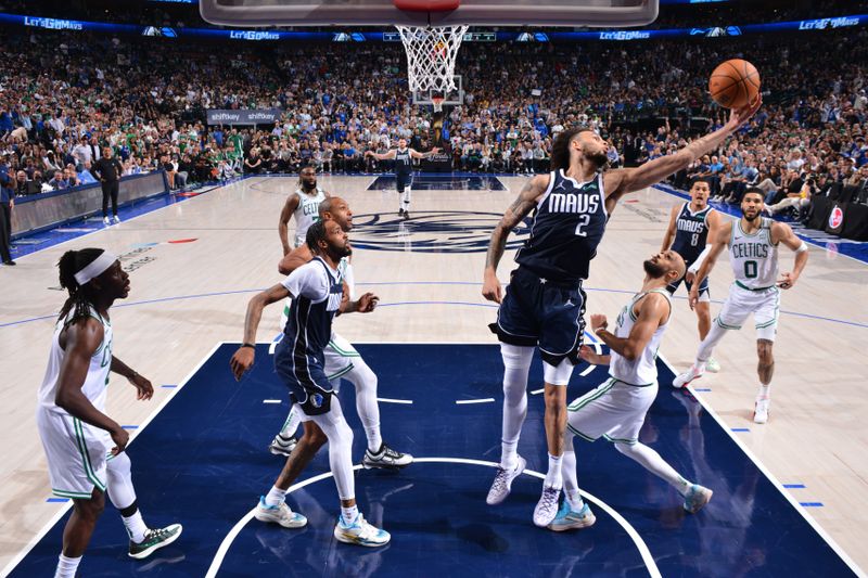 DALLAS, TX - JUNE 14: Dereck Lively II #2 of the Dallas Mavericks rebounds the ball during the game against the Boston Celtics during Game 4 of the 2024 NBA Finals on June 14, 2024 at the American Airlines Center in Dallas, Texas. NOTE TO USER: User expressly acknowledges and agrees that, by downloading and or using this photograph, User is consenting to the terms and conditions of the Getty Images License Agreement. Mandatory Copyright Notice: Copyright 2024 NBAE (Photo by Jesse D. Garrabrant/NBAE via Getty Images)