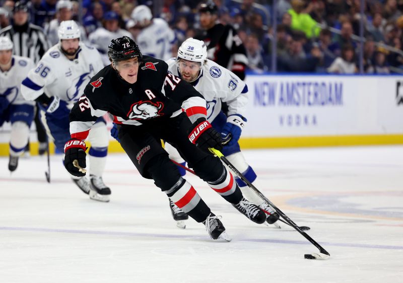 Apr 5, 2025; Buffalo, New York, USA;  Buffalo Sabres center Tage Thompson (72) controls the puck as Tampa Bay Lightning left wing Brandon Hagel (38) tries to defend during the second period at KeyBank Center. Mandatory Credit: Timothy T. Ludwig-Imagn Images