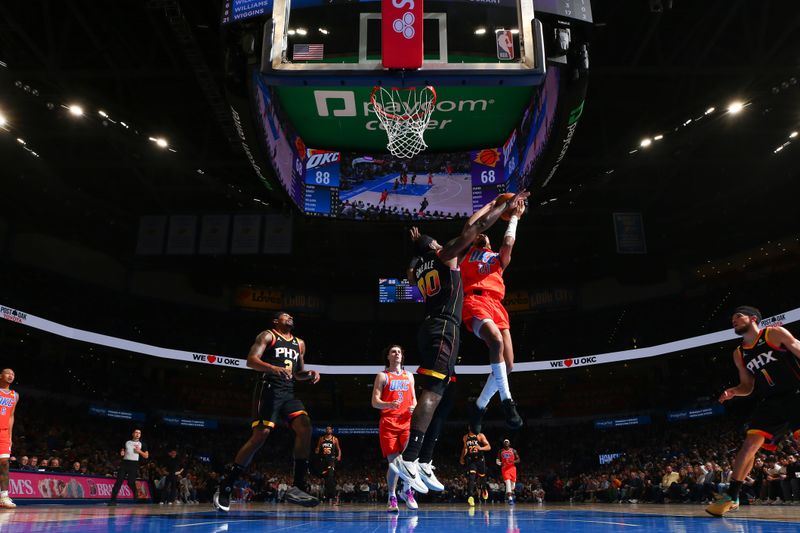 OKLAHOMA CITY, OK - MARCH 29:  Aaron Wiggins #21 of the Oklahoma City Thunder drives to the basket during the game against the Phoenix Suns on March 29, 2024 at Paycom Arena in Oklahoma City, Oklahoma. NOTE TO USER: User expressly acknowledges and agrees that, by downloading and or using this photograph, User is consenting to the terms and conditions of the Getty Images License Agreement. Mandatory Copyright Notice: Copyright 2024 NBAE (Photo by Zach Beeker/NBAE via Getty Images)