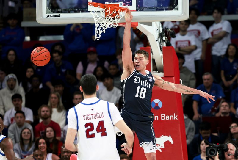 Jan 4, 2025; Dallas, Texas, USA; Duke Blue Devils forward Mason Gillis (18) dunks past Southern Methodist Mustangs center Samet Yigitoglu (24) during the second half at Moody Coliseum. Mandatory Credit: Kevin Jairaj-Imagn Images