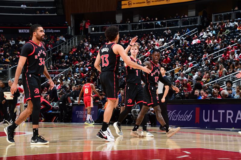 ATLANTA, GA - JANUARY 28: The Toronto Raptors celebrate during the game against the Atlanta Hawks on January 28, 2024 at State Farm Arena in Atlanta, Georgia.  NOTE TO USER: User expressly acknowledges and agrees that, by downloading and/or using this Photograph, user is consenting to the terms and conditions of the Getty Images License Agreement. Mandatory Copyright Notice: Copyright 2024 NBAE (Photo by Scott Cunningham/NBAE via Getty Images)