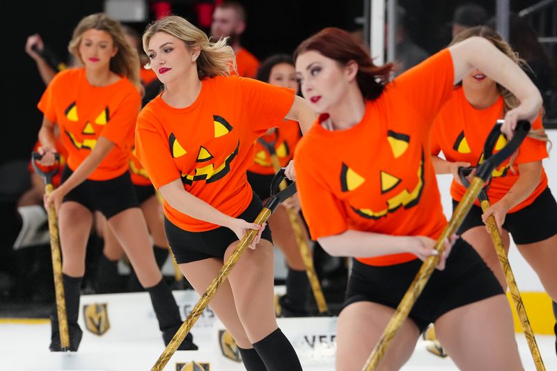 Oct 31, 2025; Las Vegas, Nevada, USA; Members of the Knight's Watch ice crew work during a game between the Vegas Golden Knights and the Colorado Avalanche during the first period at T-Mobile Arena. Mandatory Credit: Stephen R. Sylvanie-Imagn Images
