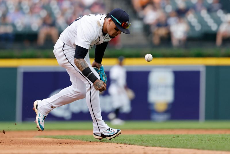Jun 26, 2025; Detroit, Michigan, USA;  Detroit Tigers shortstop Javier Baez (28) cant make the play in the third inning against the Athletics at Comerica Park. Mandatory Credit: Rick Osentoski-Imagn Images