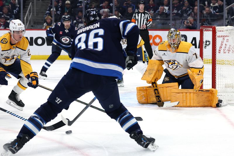 Jan 7, 2025; Winnipeg, Manitoba, CAN; Nashville Predators goaltender Juuse Saros (74) waits for an incoming shot by Winnipeg Jets center Morgan Barron (36) in the second period at Canada Life Centre. Mandatory Credit: James Carey Lauder-Imagn Images