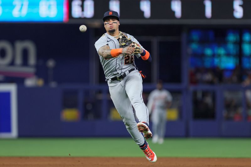 Jul 29, 2023; Miami, Florida, USA; Detroit Tigers shortstop Javier Baez (28) throws the baseball to first baseman Spencer Torkelson (not pictured) and retires Miami Marlins shortstop Joey Wendle (not pictured) during the sixth inning at loanDepot Park. Mandatory Credit: Sam Navarro-USA TODAY Sports