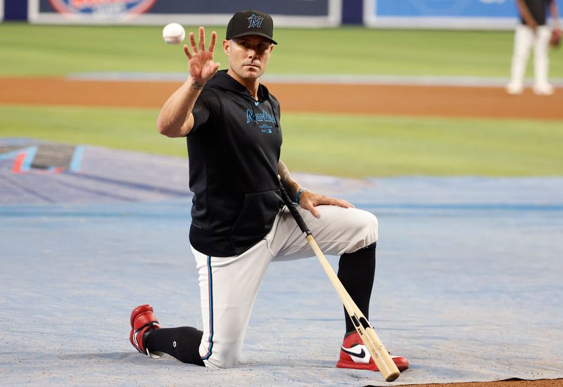 Jul 2, 2024; Miami, Florida, USA;  Miami Marlins manager Skip Schumaker (45) tosses a ball before the game against the Boston Red Sox at loanDepot Park. Mandatory Credit: Rhona Wise-USA TODAY Sports