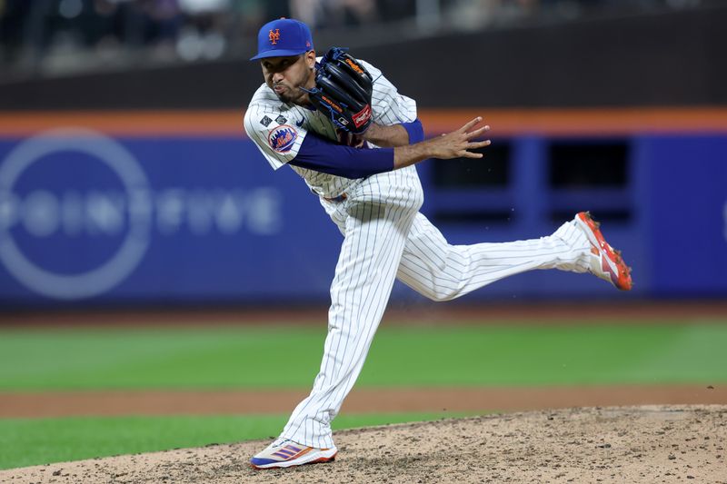 Sep 16, 2024; New York City, New York, USA; New York Mets relief pitcher Edwin Diaz (39) follows through on a pitch against the Washington Nationals during the ninth inning at Citi Field. Mandatory Credit: Brad Penner-Imagn Images