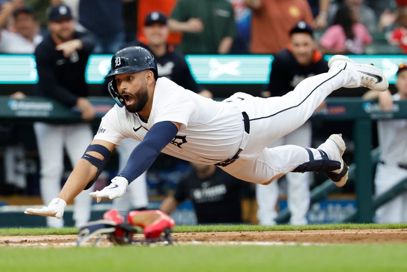 May 12, 2025; Detroit, Michigan, USA;  Detroit Tigers outfielder Riley Greene (31) dives in safe at home third inning against the Boston Red Sox at Comerica Park. Mandatory Credit: Rick Osentoski-Imagn Images