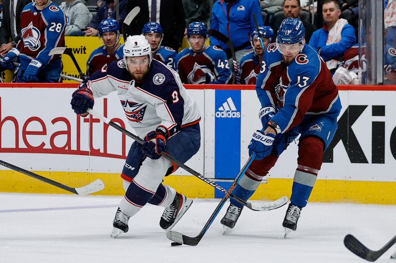 Mar 22, 2024; Denver, Colorado, USA; Columbus Blue Jackets defenseman Ivan Provorov (9) and Colorado Avalanche right wing Valeri Nichushkin (13) battle for the puck in the third period at Ball Arena. Mandatory Credit: Isaiah J. Downing-USA TODAY Sports