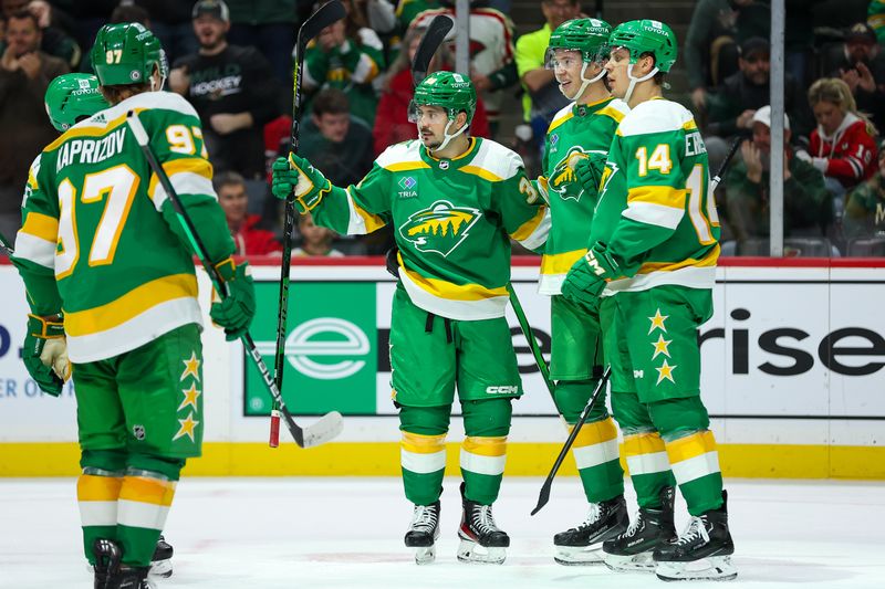 Dec 3, 2023; Saint Paul, Minnesota, USA; Minnesota Wild left wing Matt Boldy (12), celebrates his goal with right wing Mats Zuccarello (36), Minnesota Wild left wing Kirill Kaprizov (97) and center Joel Eriksson Ek (14) during the second period against the Chicago Blackhawks at Xcel Energy Center. Mandatory Credit: Matt Krohn-USA TODAY Sports