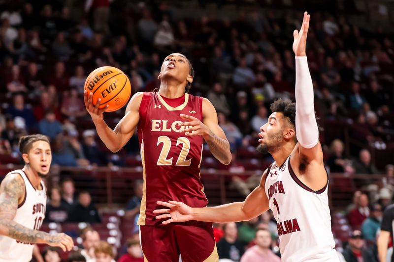 Dec 22, 2023; Columbia, South Carolina, USA; Elon Phoenix guard LA Pratt (22) drives past South Carolina Gamecocks guard Jacobi Wright (1) in the second half at Colonial Life Arena. Mandatory Credit: Jeff Blake-USA TODAY Sports