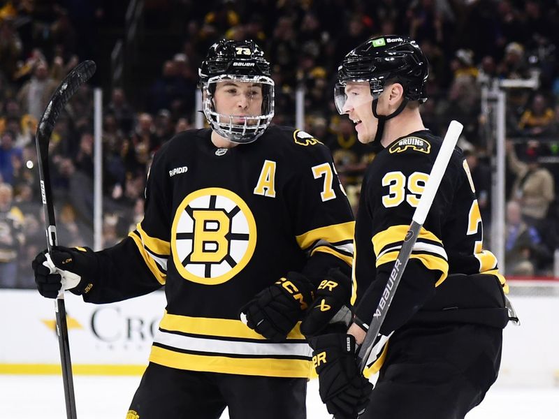 Dec 20, 2025; Boston, Massachusetts, USA; Boston Bruins center Morgan Geekie (39) celebrates scoring a goal with defenseman Charlie McAvoy (73) during the first period against the Vancouver Canucks at TD Garden. Mandatory Credit: Bob DeChiara-Imagn Images