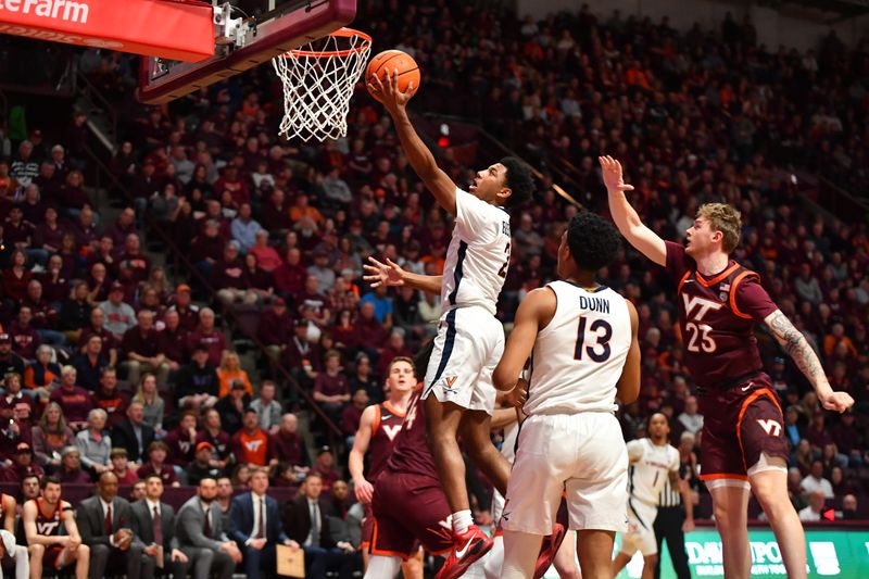 Feb 19, 2024; Blacksburg, Virginia, USA; Virginia Cavaliers guard Reece Beekman (2) moves to the basket against Virginia Tech Hokies guard Tyler Nickel (23) defends during the first half at Cassell Coliseum. Mandatory Credit: Brian Bishop-USA TODAY Sports