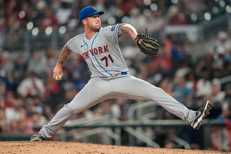 Aug 23, 2023; Cumberland, Georgia, USA; New York Mets relief pitcher Sean Reid-Foley (71) pitches against the Atlanta Braves during the eighth inning at Truist Park. Mandatory Credit: Dale Zanine-USA TODAY Sports