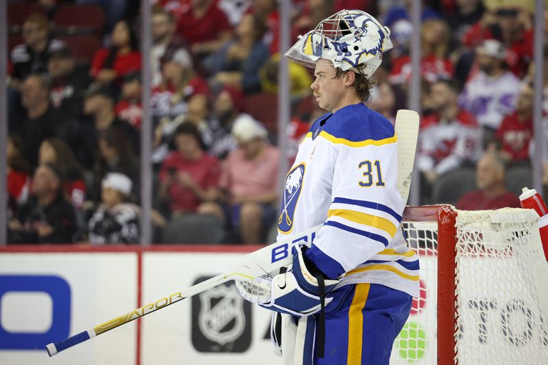 Oct 27, 2023; Newark, New Jersey, USA; Buffalo Sabres goaltender Eric Comrie (31) looks up ice during the first period against the New Jersey Devils at Prudential Center. Mandatory Credit: Vincent Carchietta-USA TODAY Sports