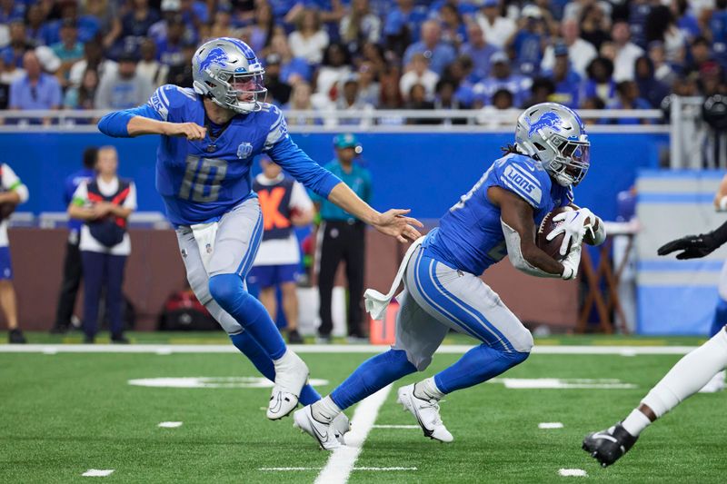 Detroit Lions quarterback Nate Sudfeld (10) hands off to running back Jermar Jefferson (28) against the Jasksonville Jaguars during an NFL pre-season football game, Saturday, Aug. 19, 2023, in Detroit. (AP Photo/Rick Osentoski)