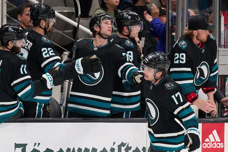 Mar 23, 2024; San Jose, California, USA; San Jose Sharks center Thomas Bordeleau (17) shakes hands with his teammates on the bench after scoring a goal against the Chicago Blackhawks during the first period at SAP Center at San Jose. Mandatory Credit: Robert Edwards-USA TODAY Sports