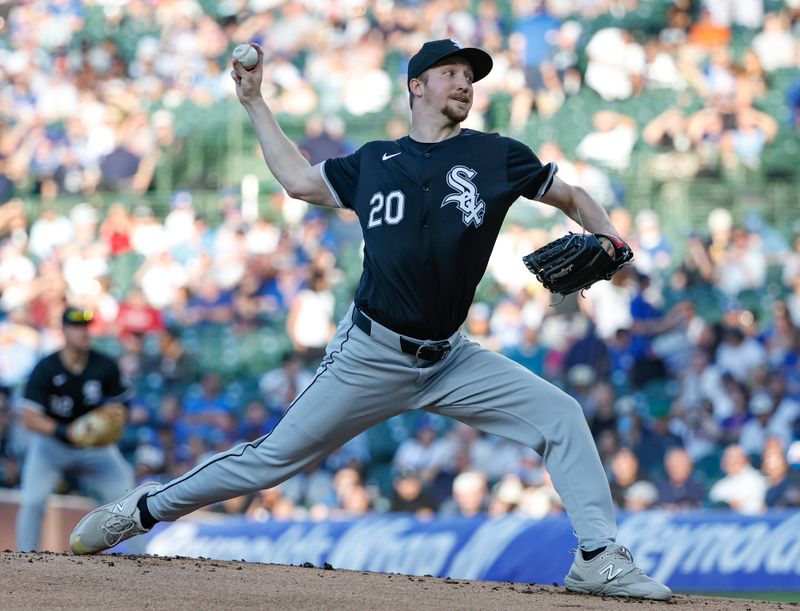 Jun 5, 2024; Chicago, Illinois, USA; Chicago White Sox starting pitcher Erick Fedde (20) delivers a pitch against the Chicago Cubs during the first inning at Wrigley Field. Mandatory Credit: Kamil Krzaczynski-USA TODAY Sports