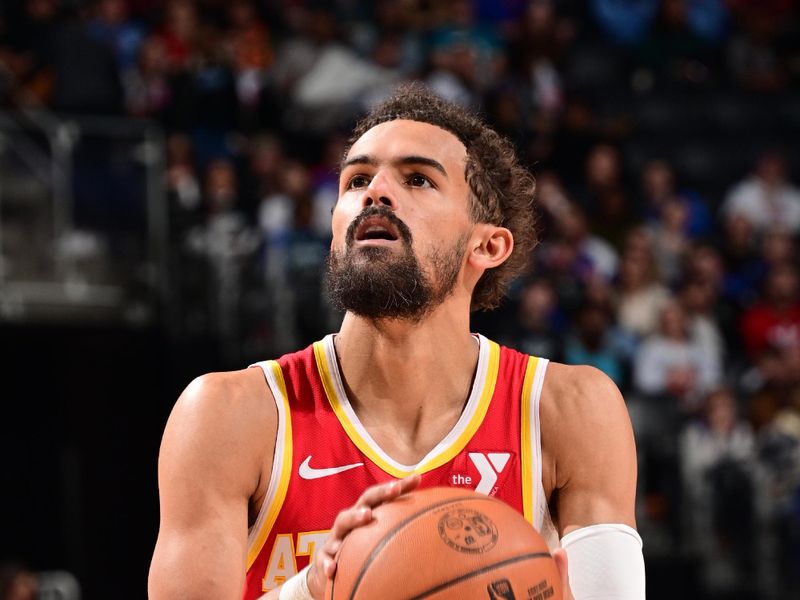 DETROIT, MI - NOVEMBER 8: Trae Young #11 of the Atlanta Hawks shoots a free throw during the game against the Detroit Pistons on November  8, 2024 at Little Caesars Arena in Detroit, Michigan. NOTE TO USER: User expressly acknowledges and agrees that, by downloading and/or using this photograph, User is consenting to the terms and conditions of the Getty Images License Agreement. Mandatory Copyright Notice: Copyright 2024 NBAE (Photo by Chris Schwegler/NBAE via Getty Images)