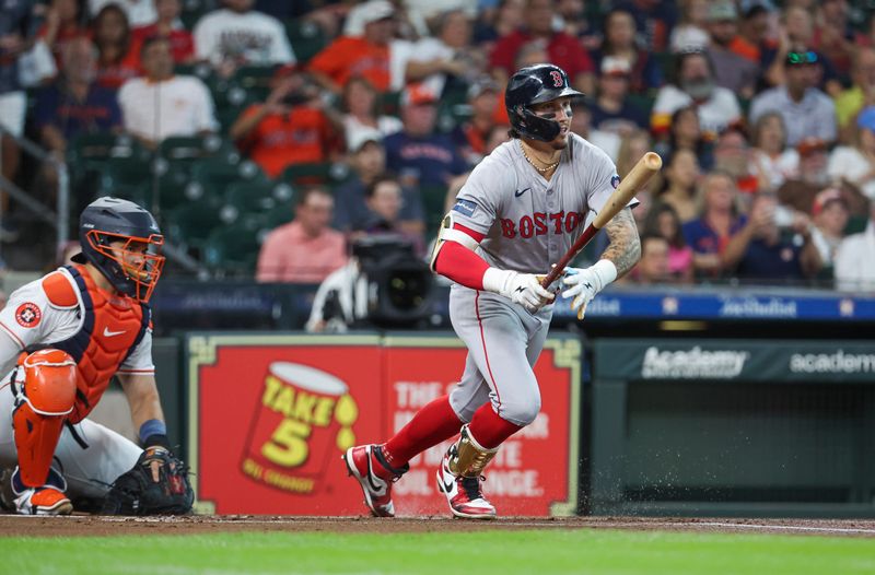 Aug 20, 2024; Houston, Texas, USA; Boston Red Sox center fielder Jarren Duran (16) hits a leadoff double during the first inning against the Houston Astros at Minute Maid Park. Mandatory Credit: Troy Taormina-USA TODAY Sports