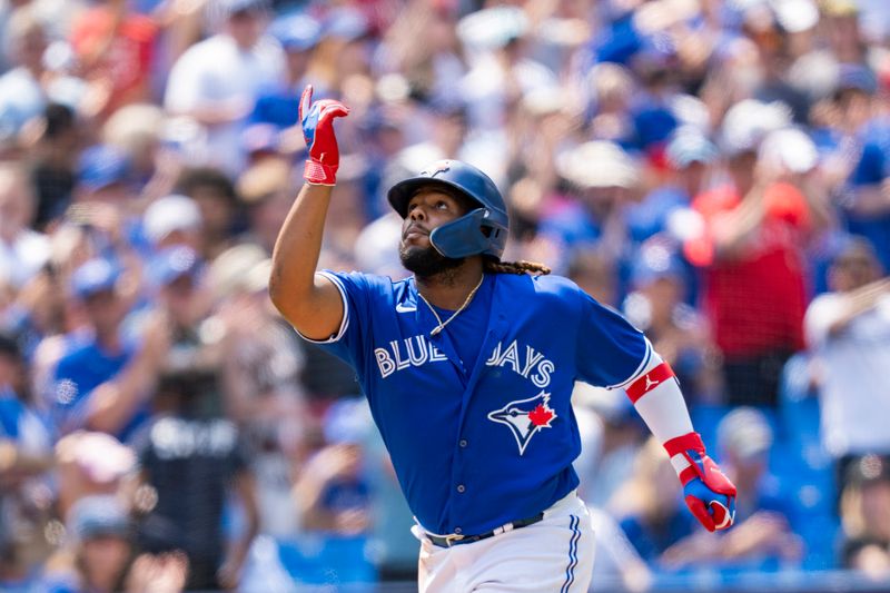 Jul 20, 2023; Toronto, Ontario, CAN; Toronto Blue Jays first baseman Vladimir Guerrero Jr. (27) celebrates after hitting a home run against the San Diego Padres during the seventh inning at Rogers Centre. Mandatory Credit: Kevin Sousa-USA TODAY Sports