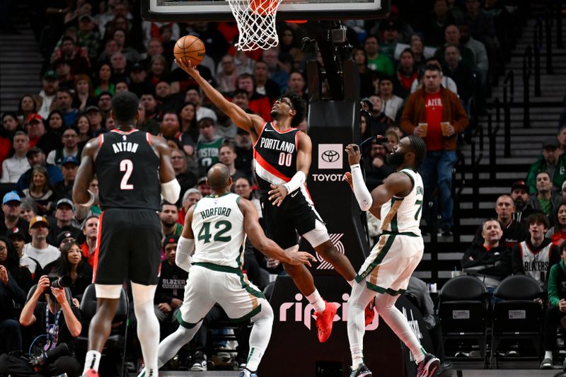 PORTLAND, OREGON - MARCH 11: Scoot Henderson #00 of the Portland Trail Blazers shoots a reverse lay up during the first quarter against the Boston Celtics at the Moda Center on March 11, 2024 in Portland, Oregon. NOTE TO USER: User expressly acknowledges and agrees that, by downloading and or using this photograph, User is consenting to the terms and conditions of the Getty Images License Agreement. (Photo by Alika Jenner/Getty Images)