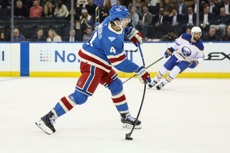 Jan 8, 2026; New York, New York, USA;  New York Rangers defenseman Braden Schneider (4) attempts a shot on goal in the first period against the Buffalo Sabres at Madison Square Garden. Mandatory Credit: Wendell Cruz-Imagn Images