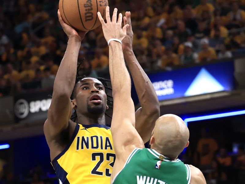 INDIANAPOLIS, INDIANA - MAY 27: Aaron Nesmith #23 of the Indiana Pacers shoots over Derrick White #9 of the Boston Celtics during the third quarter in Game Four of the Eastern Conference Finals at Gainbridge Fieldhouse on May 27, 2024 in Indianapolis, Indiana. NOTE TO USER: User expressly acknowledges and agrees that, by downloading and or using this photograph, User is consenting to the terms and conditions of the Getty Images License Agreement. (Photo by Justin Casterline/Getty Images)