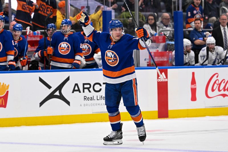 Feb 8, 2024; Elmont, New York, USA; New York Islanders center Bo Horvat (14) celebrates his goal against the Tampa Bay Lightning during the second period at UBS Arena. Mandatory Credit: Dennis Schneidler-USA TODAY Sports