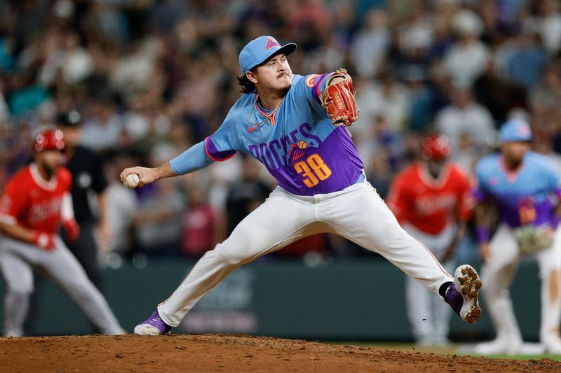 Sep 19, 2025; Denver, Colorado, USA; Colorado Rockies relief pitcher Victor Vodnik (38) pitches in the ninth inning against the Los Angeles Angels at Coors Field. Mandatory Credit: Isaiah J. Downing-Imagn Images