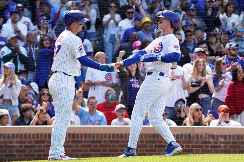 Jun 1, 2025; Chicago, Illinois, USA; Chicago Cubs outfielder Seiya Suzuki (left) and outfielder Pete Crow-Armstrong (right) celebrate after scoring against the Cincinnati Reds during the seventh inning Wrigley Field. Mandatory Credit: David Banks-Imagn Images