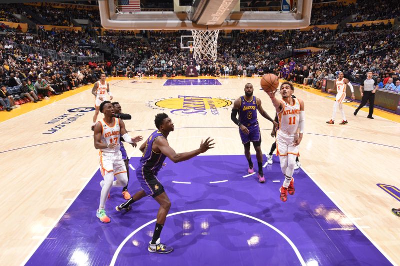 LOS ANGELES, CA - JANUARY 6: Trae Young #11 of the Atlanta Hawks drives to the basket during the game against the Los Angeles Lakers on January 6, 2023 at Crypto.Com Arena in Los Angeles, California. NOTE TO USER: User expressly acknowledges and agrees that, by downloading and/or using this Photograph, user is consenting to the terms and conditions of the Getty Images License Agreement. Mandatory Copyright Notice: Copyright 2023 NBAE (Photo by Andrew D. Bernstein/NBAE via Getty Images)