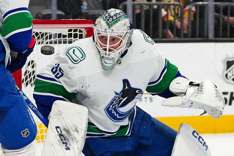 Mar 7, 2024; Las Vegas, Nevada, USA; Vancouver Canucks goaltender Thatcher Demko (35) makes a save against the Vegas Golden Knights during the second period at T-Mobile Arena. Mandatory Credit: Stephen R. Sylvanie-USA TODAY Sports