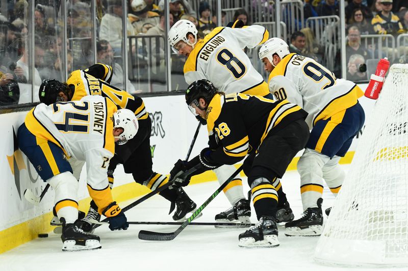 Mar 4, 2025; Boston, Massachusetts, USA;  Boston Bruins center Georgii Merkulov (42) battles for the puck with Nashville Predators defenseman Spencer Stastney (24) during the first period at TD Garden. Mandatory Credit: Bob DeChiara-Imagn Images