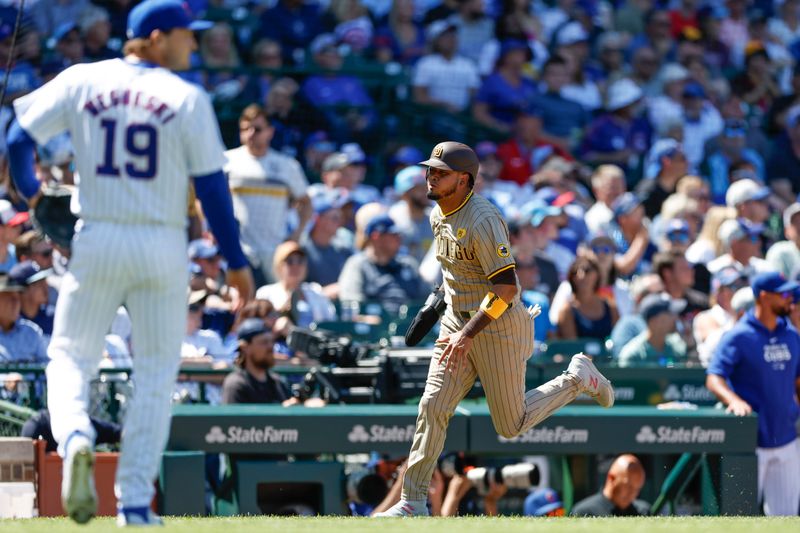 May 8, 2024; Chicago, Illinois, USA; San Diego Padres second base Luis Arraez (4) runs to score against the Chicago Cubs during the fifth inning at Wrigley Field. Mandatory Credit: Kamil Krzaczynski-USA TODAY Sports