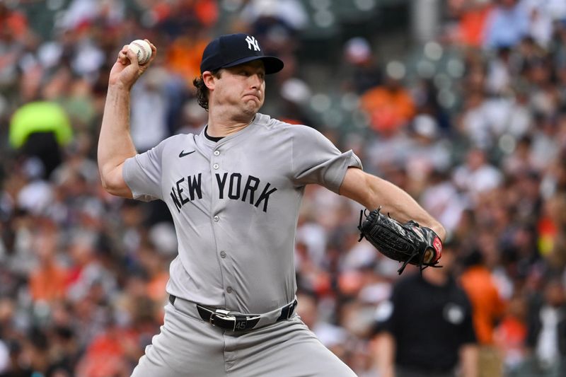 Jul 12, 2024; Baltimore, Maryland, USA;  New York Yankees pitcher Gerrit Cole (45) throws a first inning pitch against the Baltimore Orioles at Oriole Park at Camden Yards. Mandatory Credit: Tommy Gilligan-USA TODAY Sports