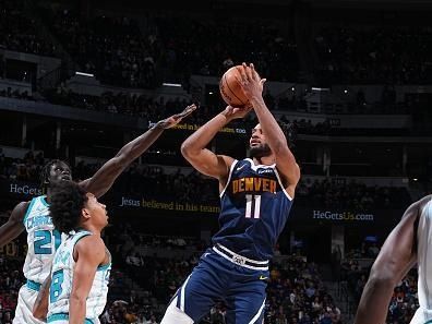 DENVER, CO - JANUARY 1: Braxton Key #11 of the Denver Nuggets shoots the ball during the game against the Charlotte Hornets on January 1, 2024 at the Ball Arena in Denver, Colorado. NOTE TO USER: User expressly acknowledges and agrees that, by downloading and/or using this Photograph, user is consenting to the terms and conditions of the Getty Images License Agreement. Mandatory Copyright Notice: Copyright 2024 NBAE (Photo by Garrett Ellwood/NBAE via Getty Images)