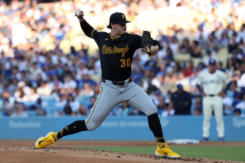 Aug 10, 2024; Los Angeles, California, USA;  Pittsburgh Pirates starting pitcher Paul Skenes (30) pitches during the second inning against the Los Angeles Dodgers at Dodger Stadium. Mandatory Credit: Kiyoshi Mio-USA TODAY Sports