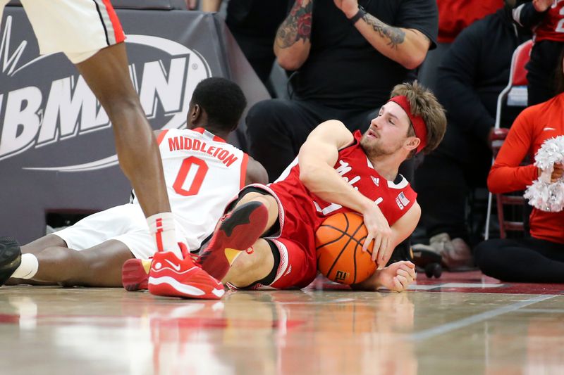 Feb 29, 2024; Columbus, Ohio, USA;  Nebraska Cornhuskers guard Sam Hoiberg (1) goes for the ball with Ohio State Buckeyes guard Scotty Middleton (0) during the second half at Value City Arena. Mandatory Credit: Joseph Maiorana-USA TODAY Sports